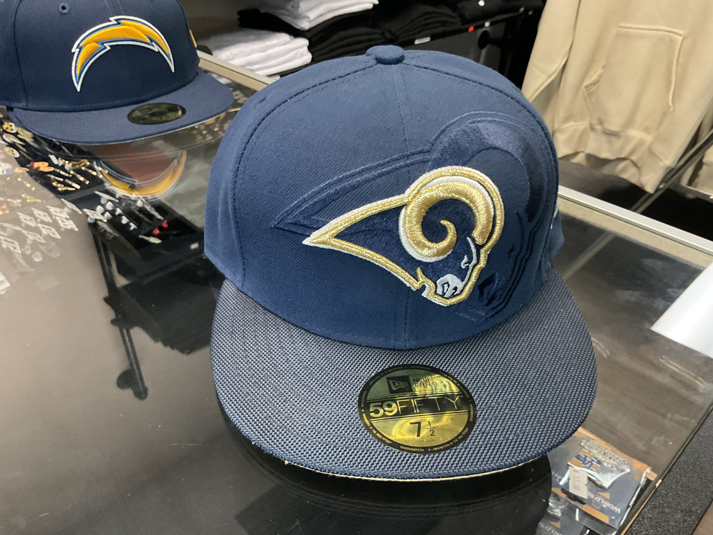 NEW ERA LOS ANGELES RAMS NAVY BLUE FITTED HAT….
