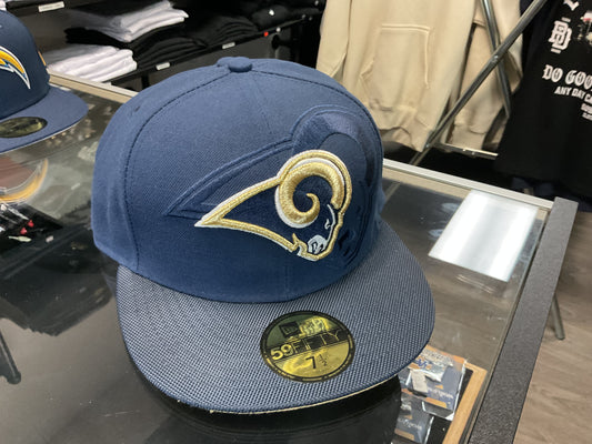 NEW ERA LOS ANGELES RAMS NAVY BLUE FITTED HAT….