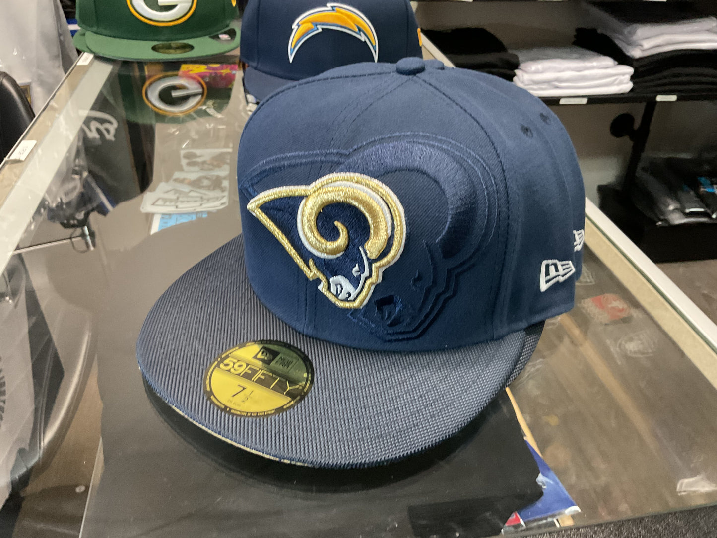NEW ERA LOS ANGELES RAMS NAVY BLUE FITTED HAT….