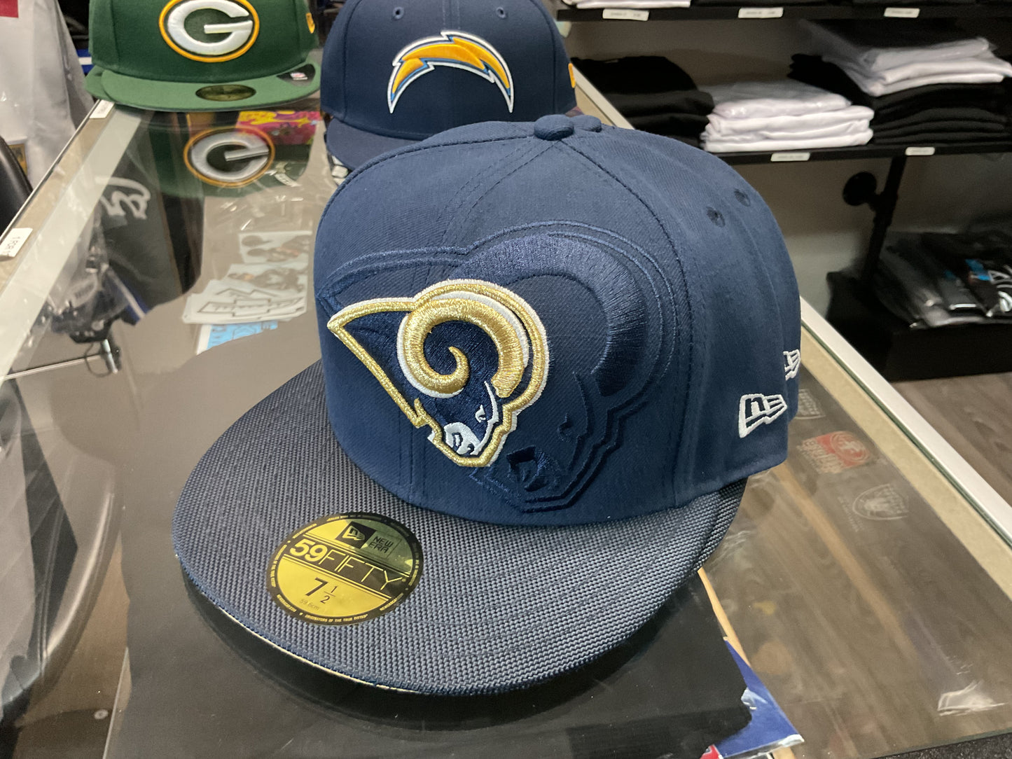 NEW ERA LOS ANGELES RAMS NAVY BLUE FITTED HAT….