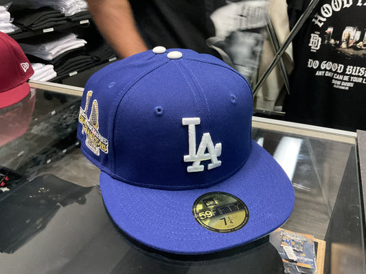 NEW ERA LOS ANGELES DODGERS WORLD SERIES BLUE/WHITE  FITTED HAT….