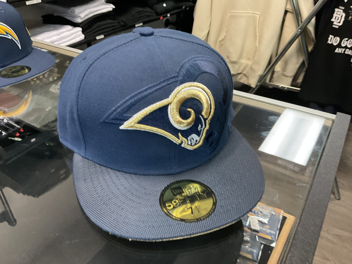 NEW ERA LOS ANGELES RAMS NAVY BLUE FITTED HAT….