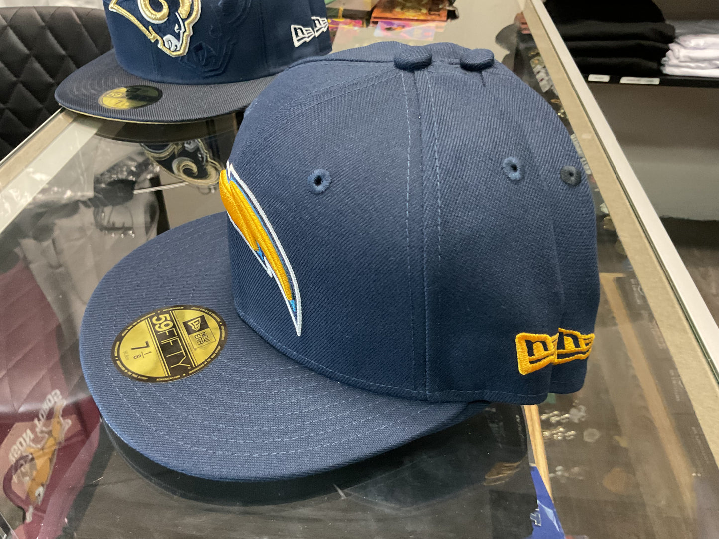 NEW ERA LOS ANGELES CHARGERS NAVY BLUE  FITTED HAT….